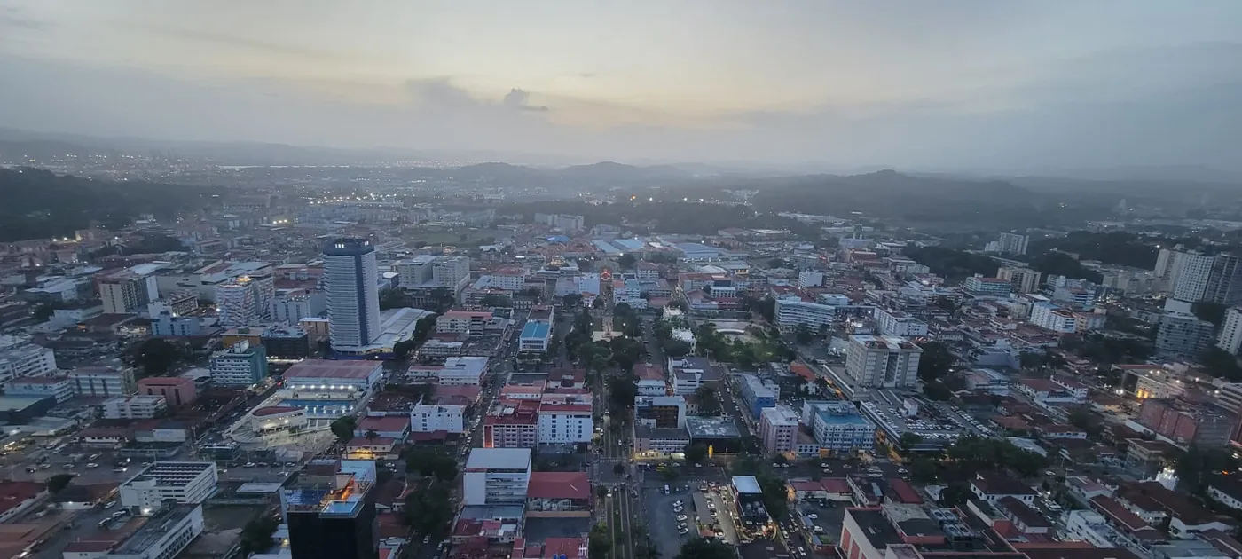 Panama City at sunset with hills and the bay in the distance